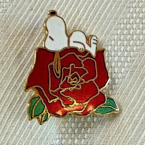Vintage Peanuts Snoopy Collectible Enamel pin / brooch sitting on a rose 1 "